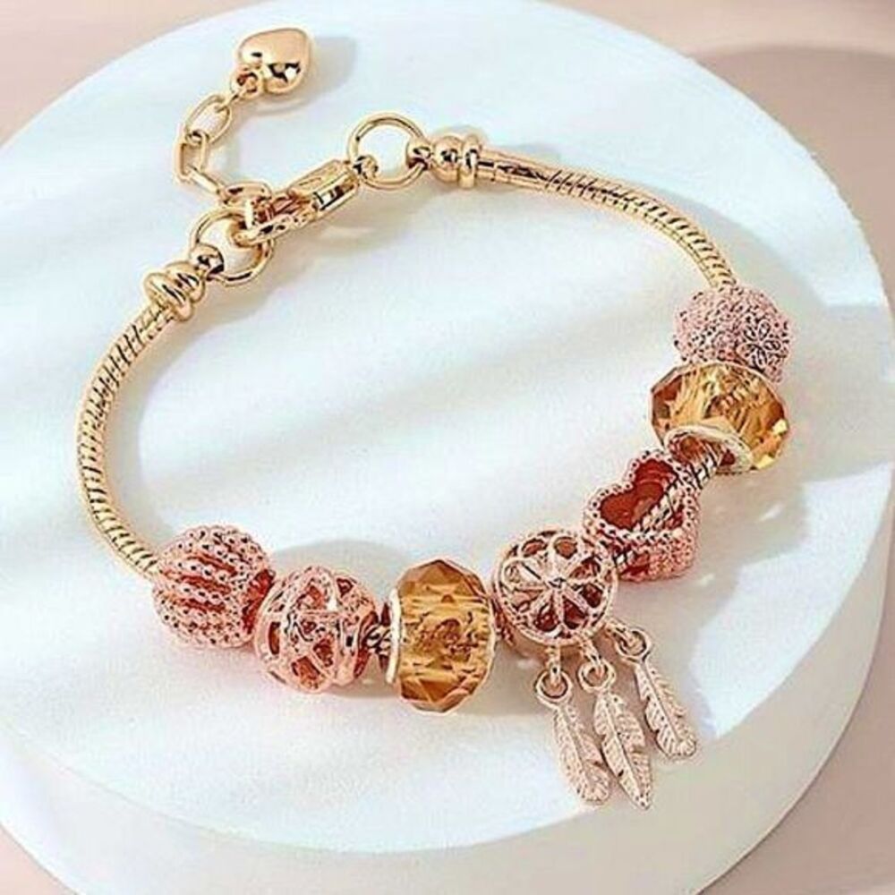 Chic Gold Tone Charm Bracelet Boho Feathers, Sparkle Crystal, and Ornate Beads